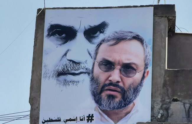 ifmat - Poster of Hezbollah commander with Ruhollah Khomeini in Nabatieh town